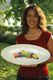 Donna holding the platter that her sisters made for her in San Louis Obispo.